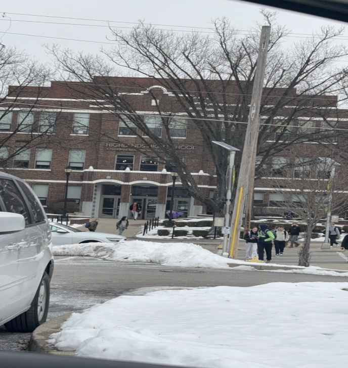 Highlands High School, January 23rd, 2025, witnessing yet another day of drowsy and muddy snow as students make their way into the warmth of the school building.